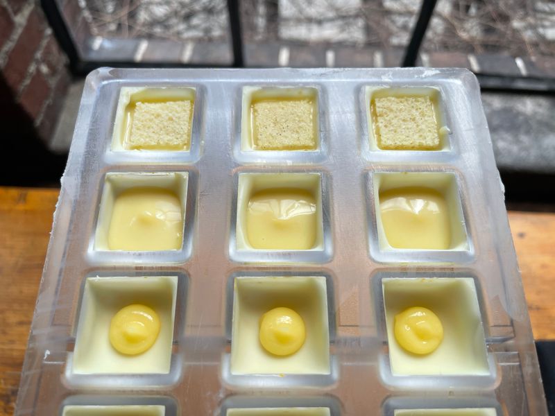 Pale Meyer lemon bonbons setting in a silicone mold