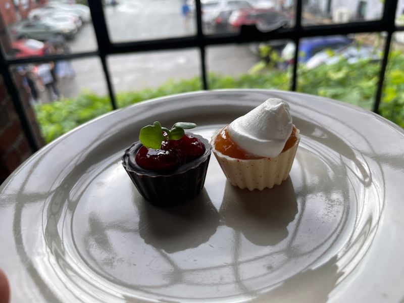 Plated bonbons and petit fours on small white plates